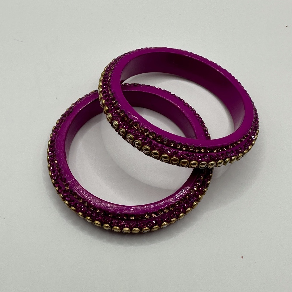 Two resin bangle bracelets with embellishments
